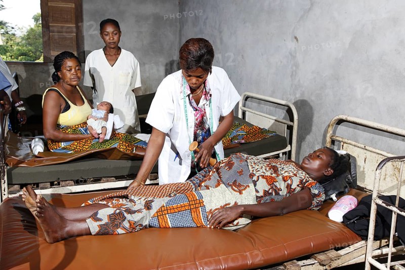 Pregnant woman being examined by a doctor