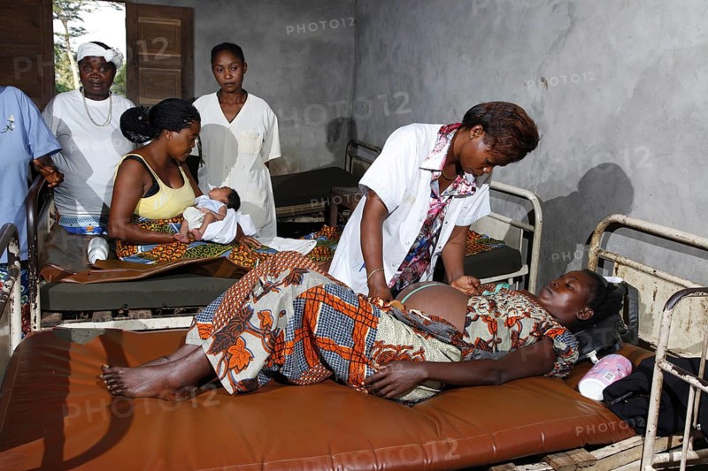 Pregnant woman being examined by a doctor