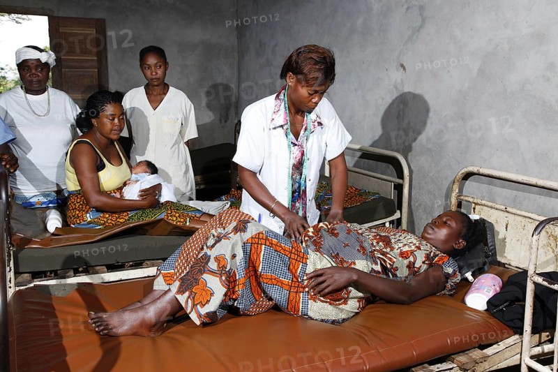 Pregnant woman being examined by a doctor