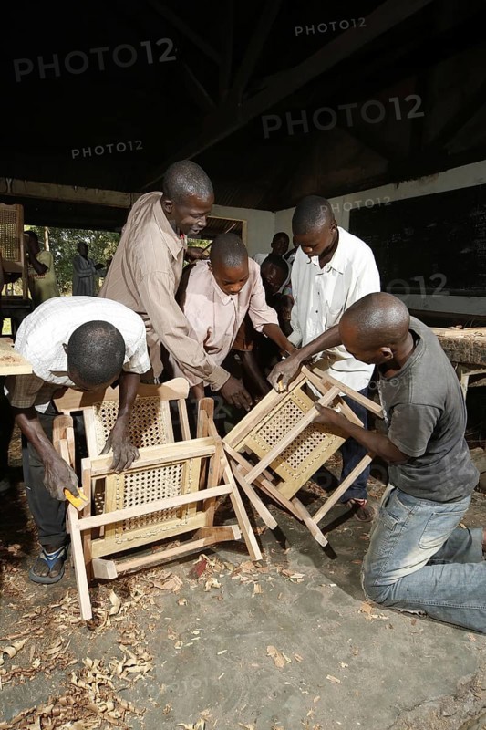 Apprentices working on chair
