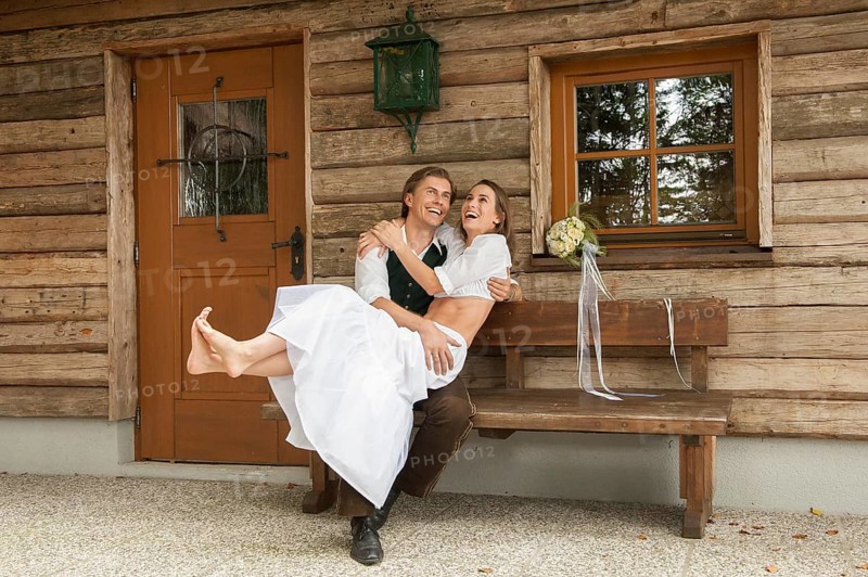 Wedding couple in front of an alpine mountain hut