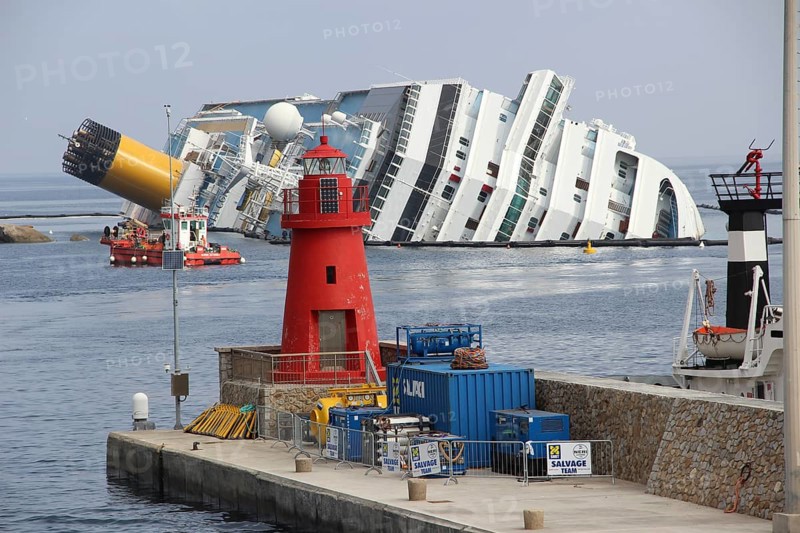 Damaged cruise ship Costa Concordia laying in Giglio Porto harbour