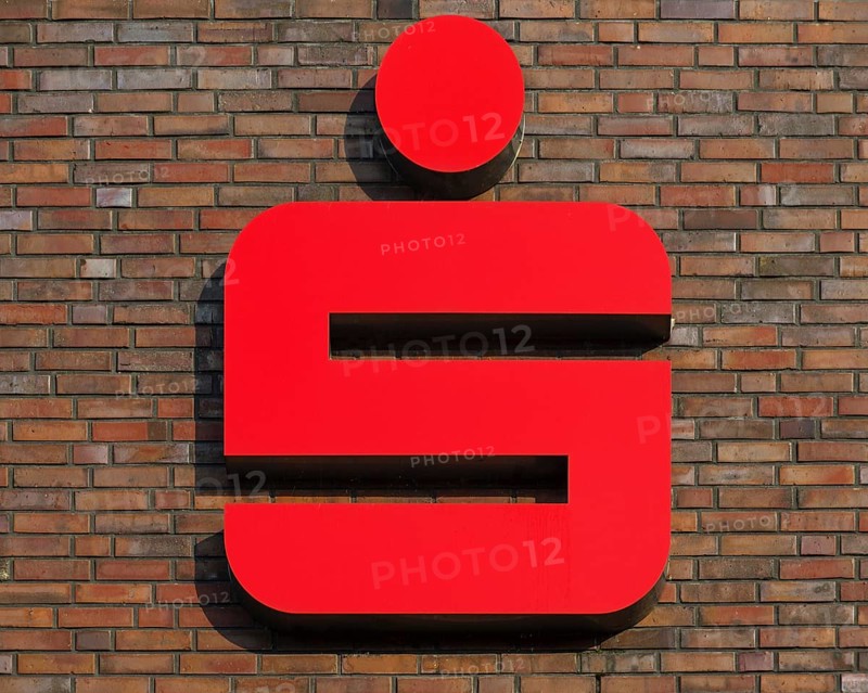 Sparkasse logo on a brick house wall