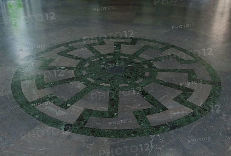 Ornament of the Black Sun wheel mosaic with superimposed swastikas in the floor of Obergruppenfuhrersaal