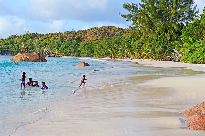 Children bathing on Anse Lazio beach