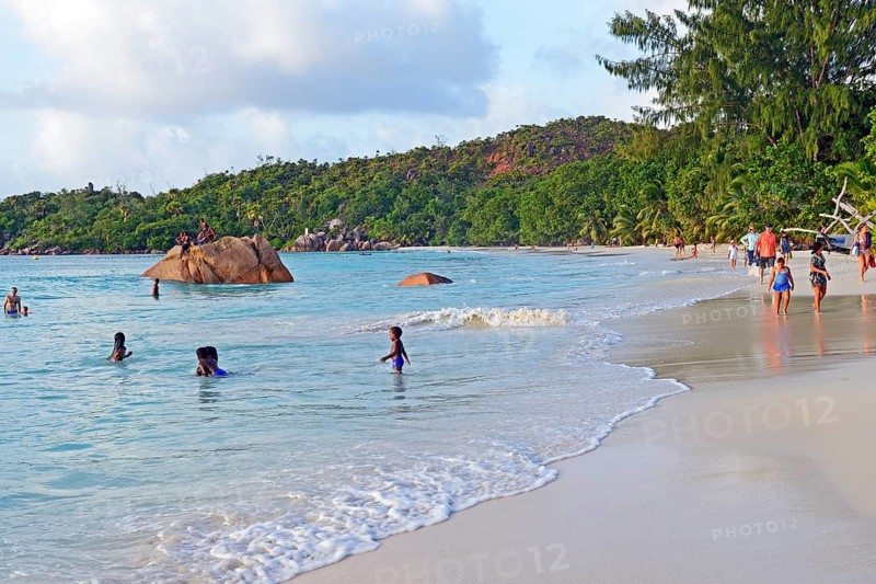 People enjoying the beach in the evening