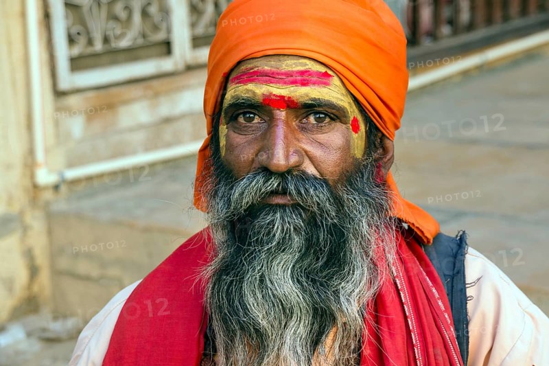 Portrait of a Rajasthani man with orange turban and beard