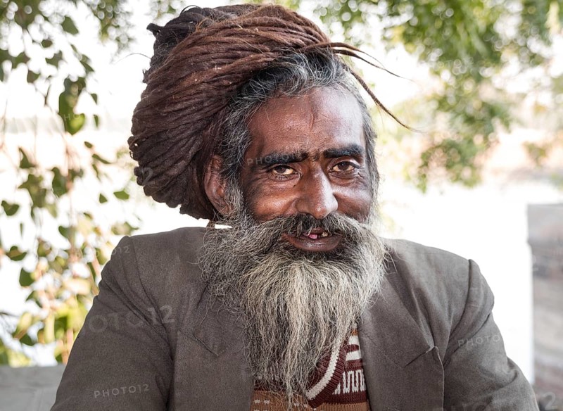 Smiling Rajasthani with matted hair and beard
