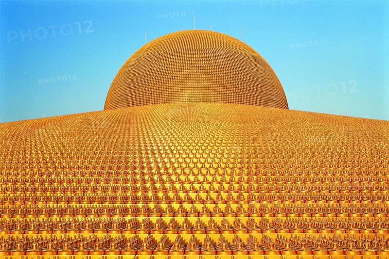 Buddhist temple Wat Phra Dhammakaya with golden Dhammakaya Buddha statues on the Chedi