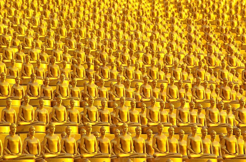 Small golden Dhammakaya Buddha statues at the Chedi