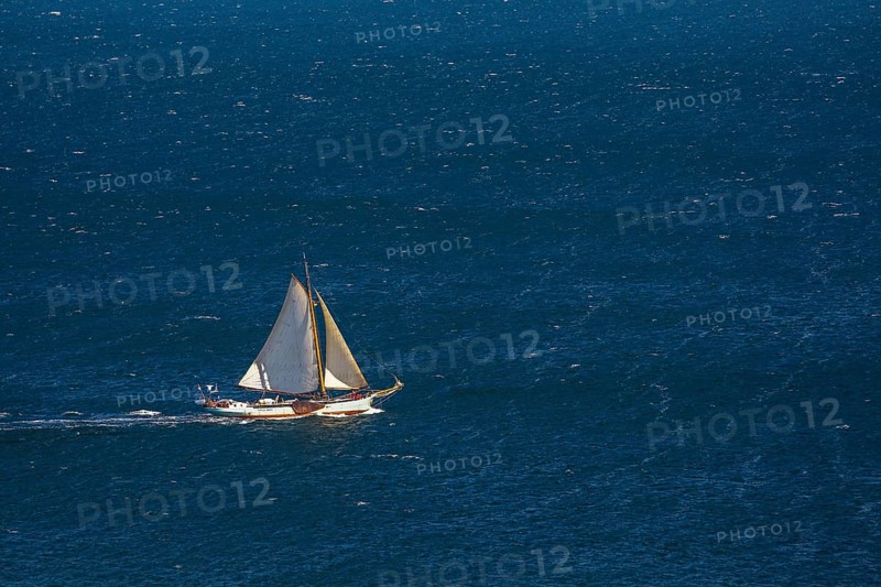 Sailing boat on windy sea