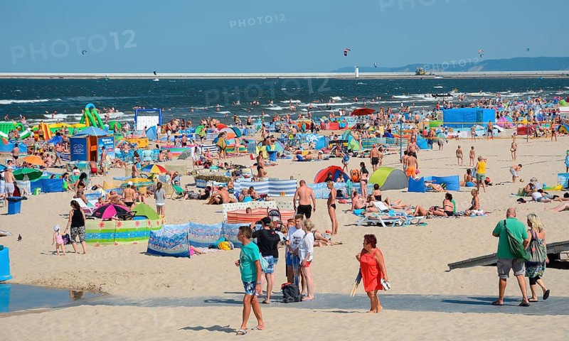 Crowded beach with bathers and sunbathers in Swinoujscie