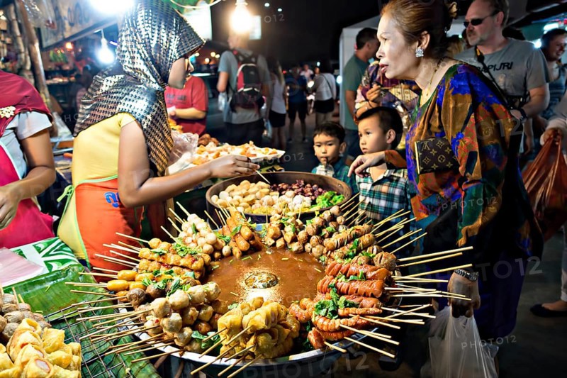 Stall with a large pot with skewers