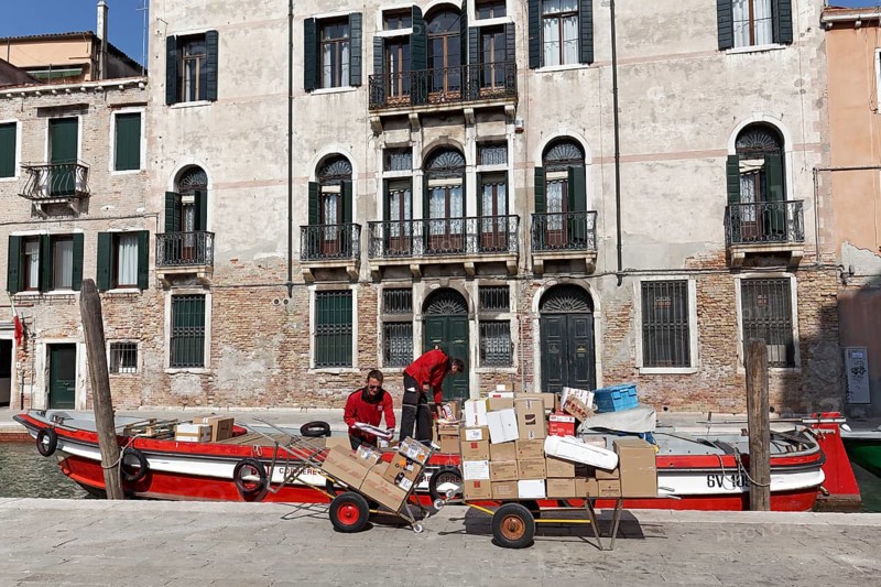 Boat with packages on a channel