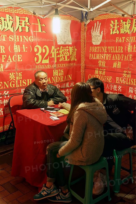 Chinese soothsayers in a lit tent