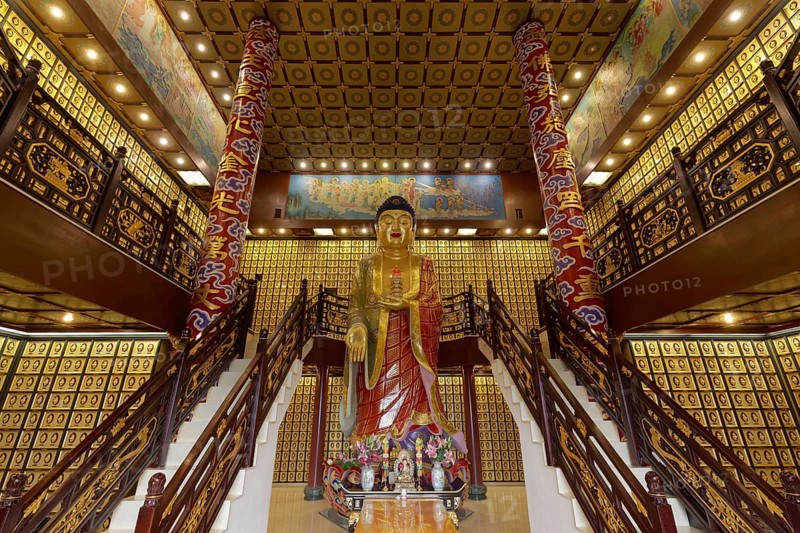 Buddhist funeral hall with urns with larger than life Amitabha Buddha statue
