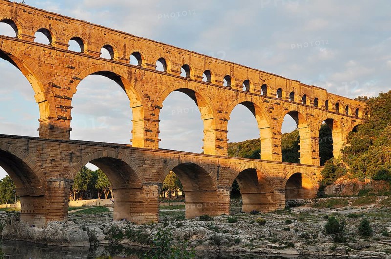 Roman aqueduct Pont du Gard over the Gardon in the evening