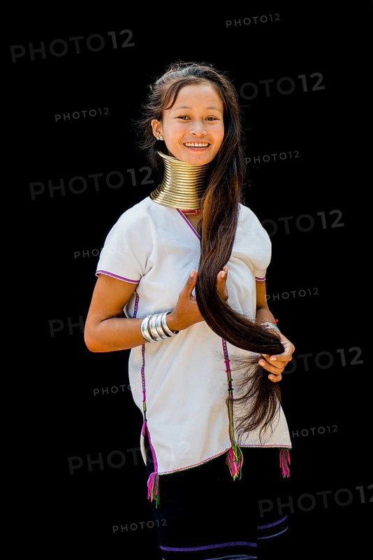 Young Kayan hill tribe woman doing her hair