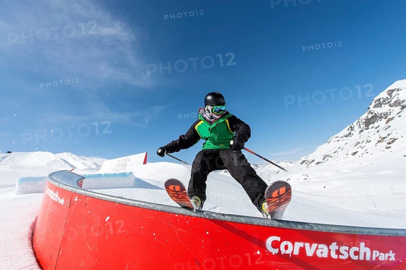 Skier on rail in the park