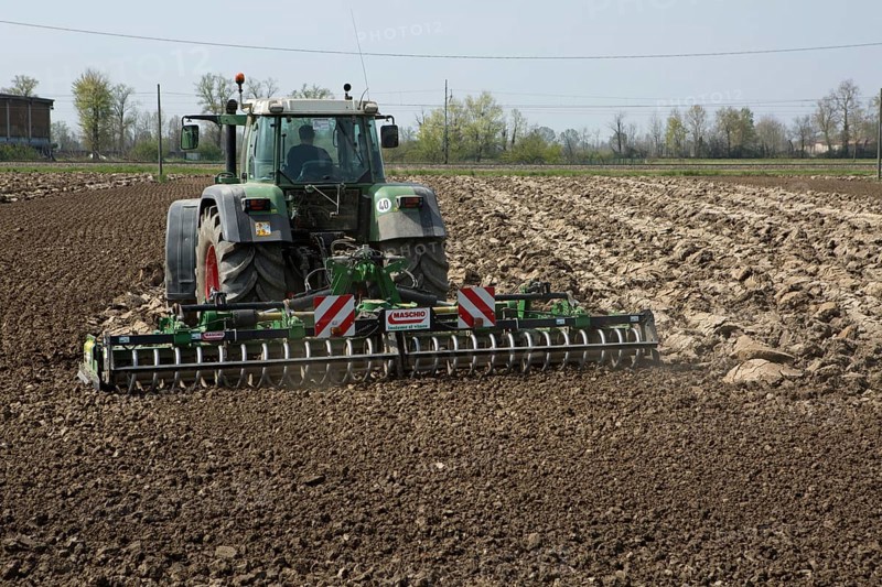 Tractor plowing a field in spring