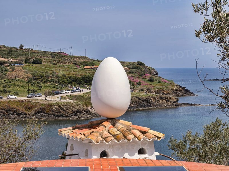 Salvador Dali sculpture of an egg on top of a dovecote