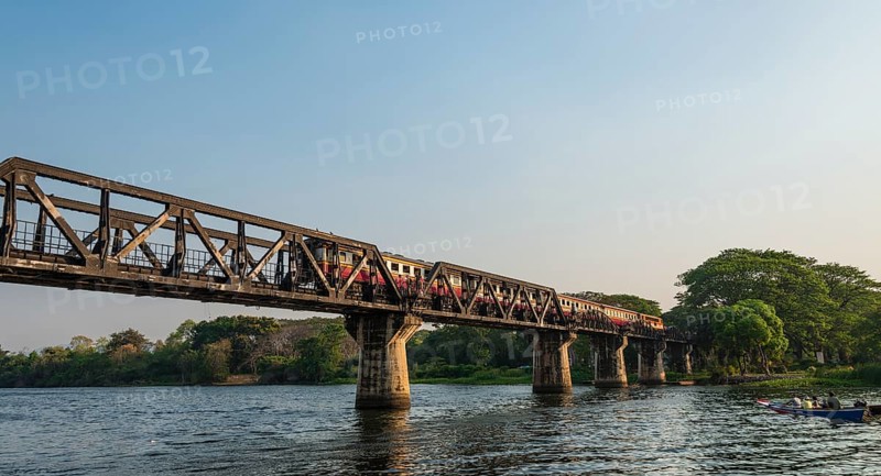 Train crossing historical River Kwai Bridge