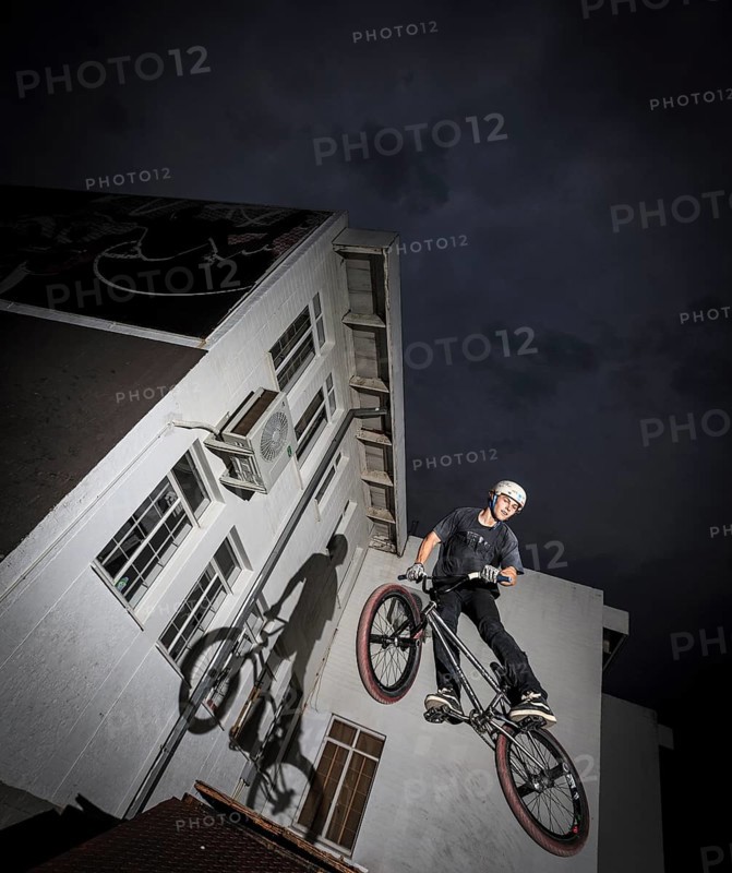 Teenager with BMX bike at skate park