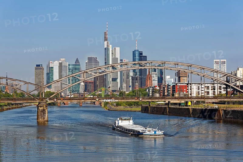 Freighter on River Main beneath Deutschherrnbrucke and skyline