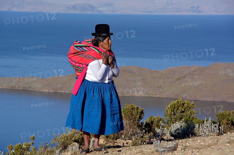 Indio woman in traditional festive costume for the New Year Festival of the Aymara Indians