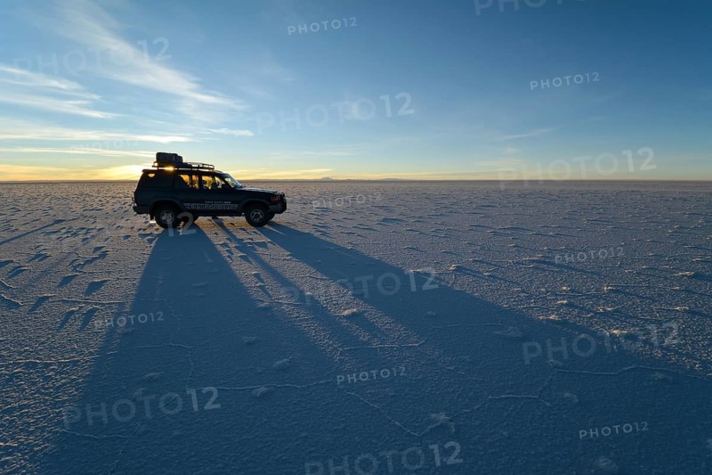 SUV shadow on salt flat