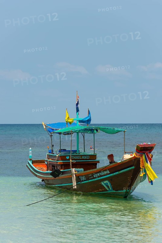 Longtail boat in the turquoise sea