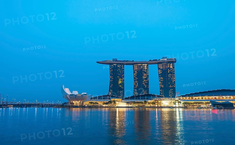 Marina Bay Sands Hotel by the Singapore River at dusk