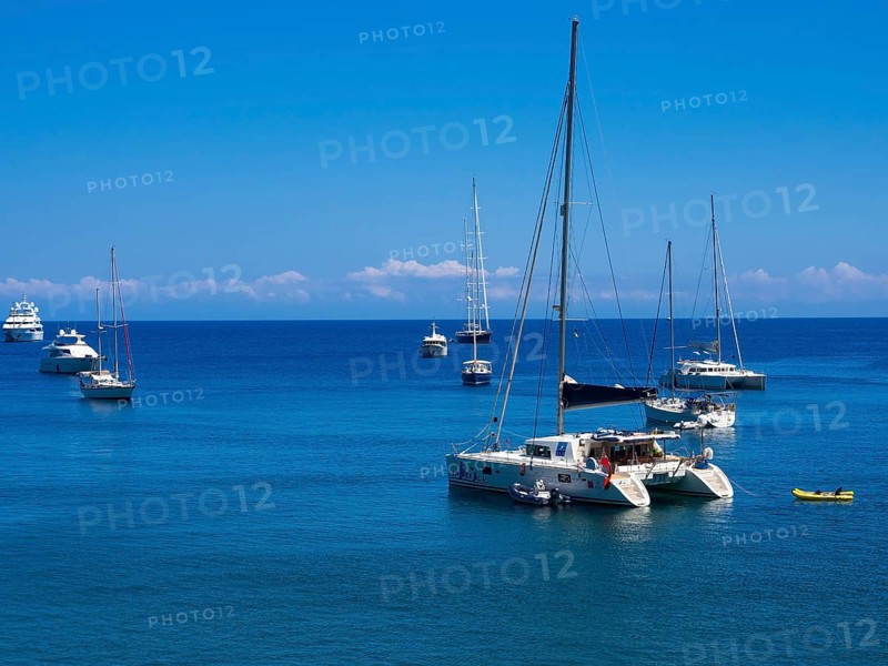 Bay with yachts off the coastal town of Panarea