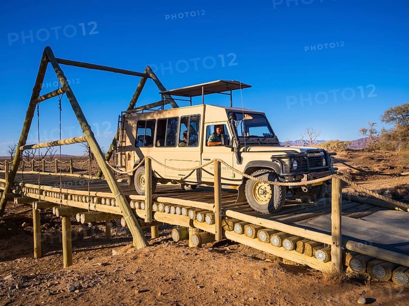 Land Rover crossing a wooden bridge in the Kulala Wilderness Reserve on the edge of the Namib Desert