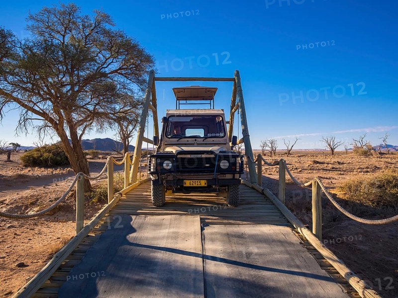 Land Rover crossing a wooden bridge in the Kulala Wilderness Reserve on the edge of the Namib Desert