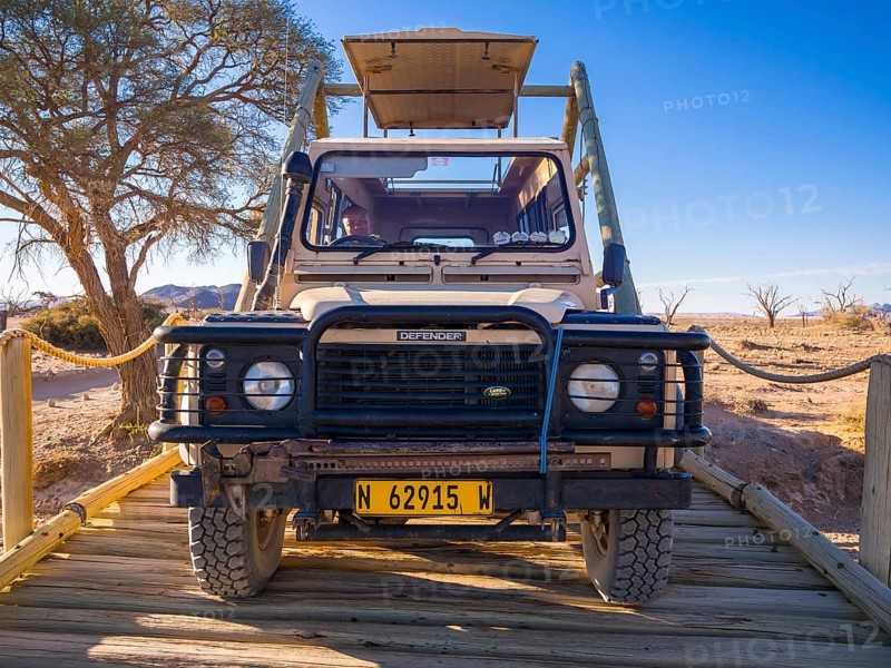 Land Rover crossing a wooden bridge in the Kulala Wilderness Reserve on the edge of the Namib Desert