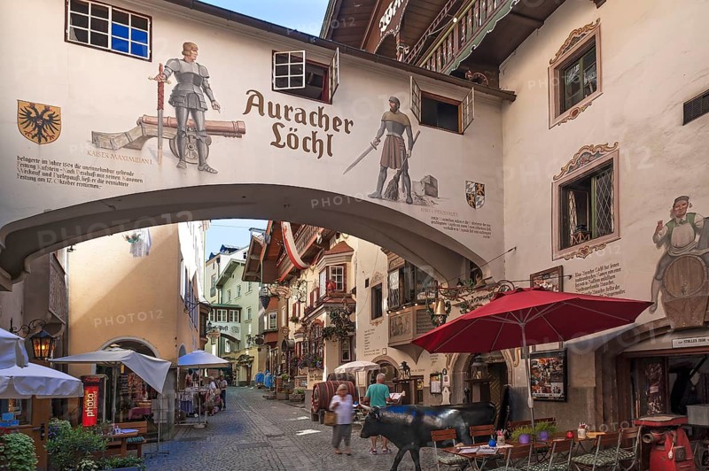 View into an alley of the the historic centre with a restaurant