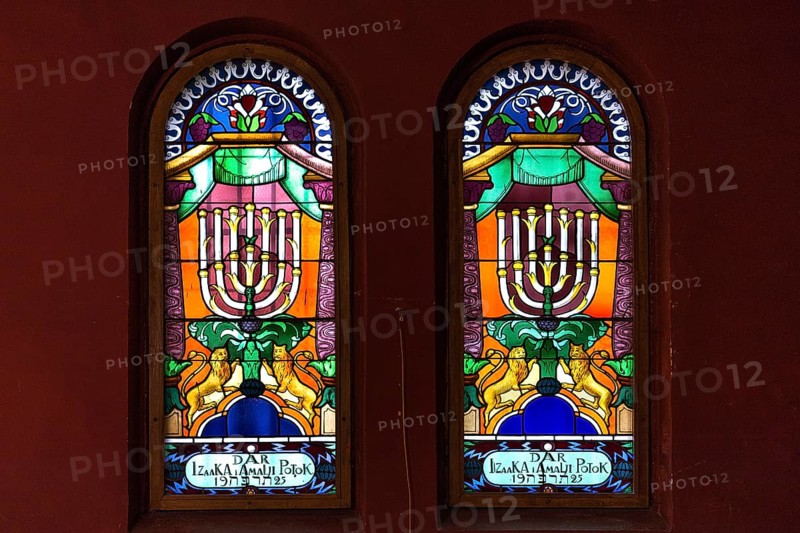 Coloured stained glass windows with seven-armed chandelier