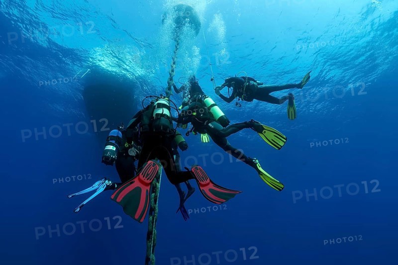 Group of divers after deep dive