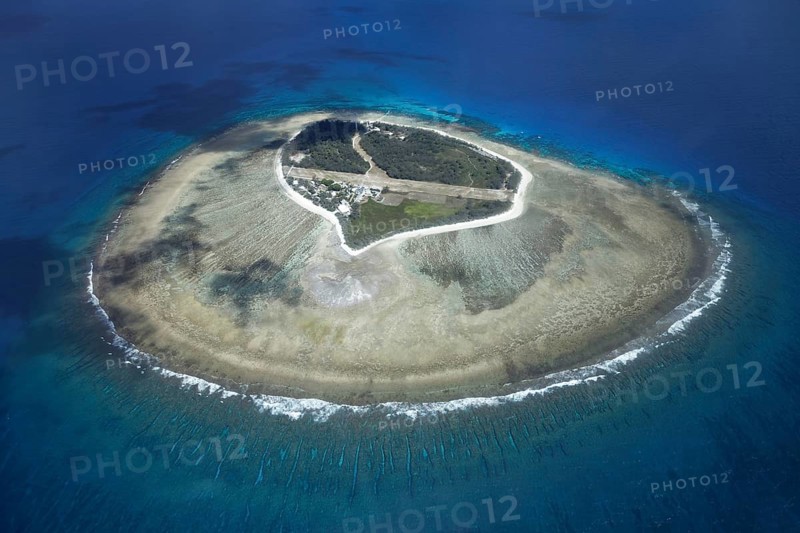 Fringing reef around small island with runway