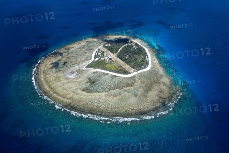 Fringing reef around small island with runway