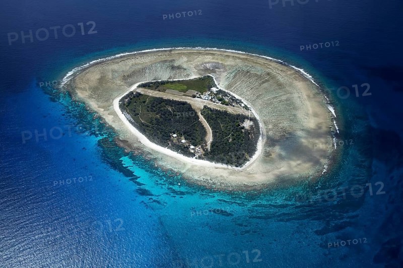Fringing reef around small island with runway