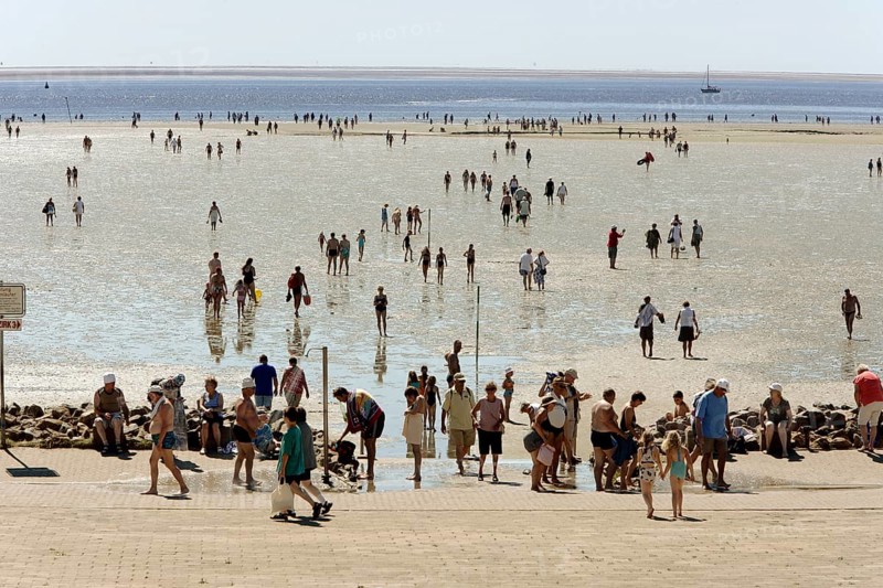 Strollers walking at low tide on the foreshore