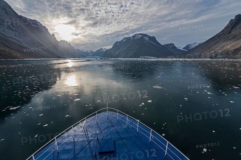 Expedition ship sailing through ice floes