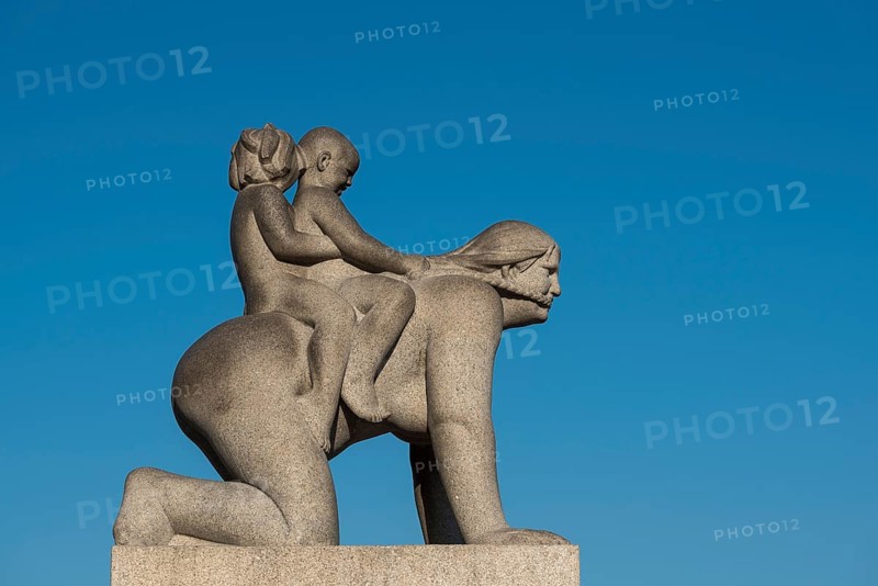 Children riding on woman's back