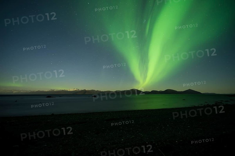Aurora borealis and moonlight over Prince William Sound