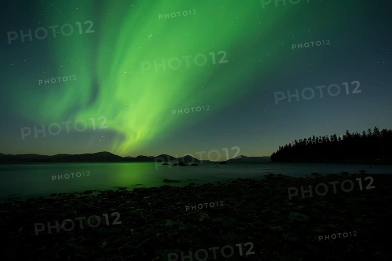 Aurora borealis and moonlight over Prince William Sound