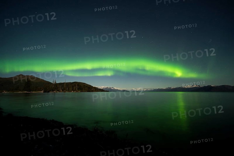Aurora borealis and moonlight over Prince William Sound