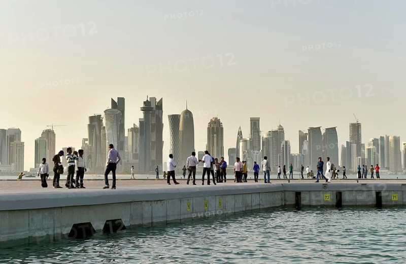 Passers-by and skyscraper skyline