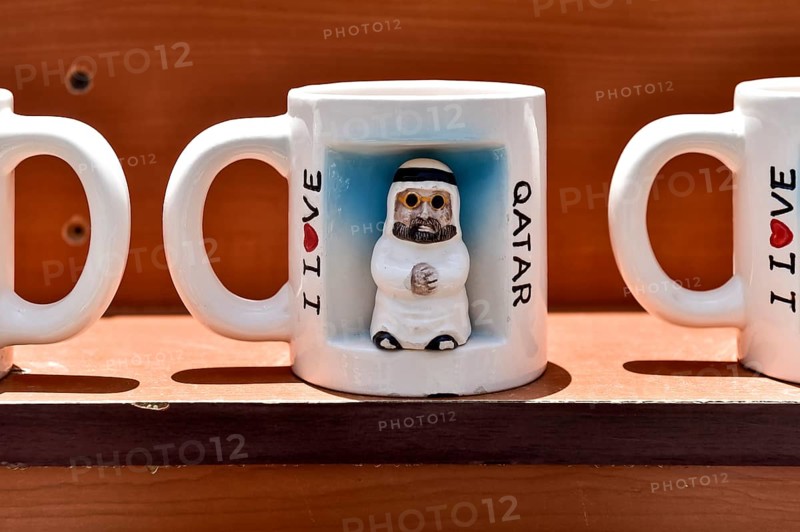 Souvenir mug with illustration of an Arab man